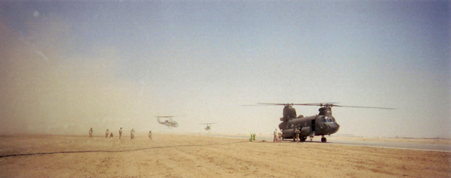 Up at toleal,two cobras dust us while refuling our chinook on  a supply run.